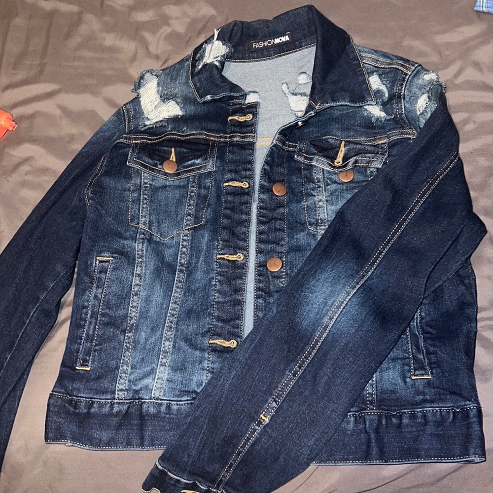Ripped dark denim Jean jacket .